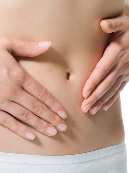 155440535 Hands touching a female belly
